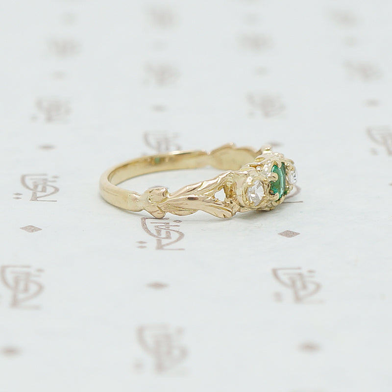 emerald and mine cut diamond ring side view