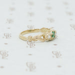 emerald and mine cut diamond ring side view