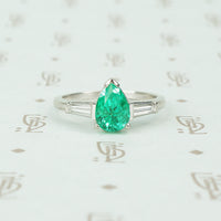 1.08 carat pear shaped emerald platinum baguette diamonds engagement ring