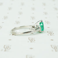 1.08 carat pear shaped emerald platinum baguette diamonds engagement ring