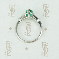 1.08 carat pear shaped emerald platinum baguette diamonds engagement ring