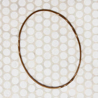 The Endless Twist Oval Bangle in Bronze from Allie B.