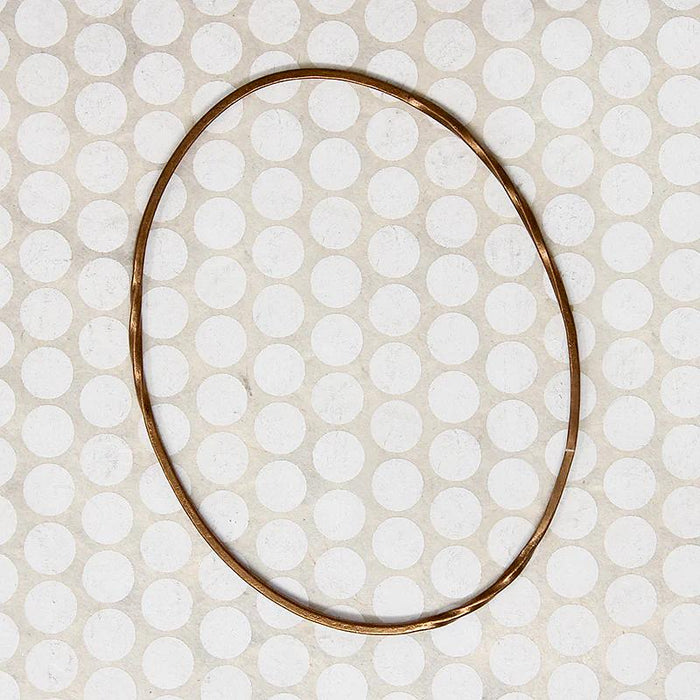 The Endless Twist Oval Bangle in Bronze from Allie B.
