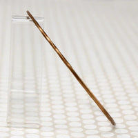 The Endless Twist Oval Bangle in Bronze from Allie B.