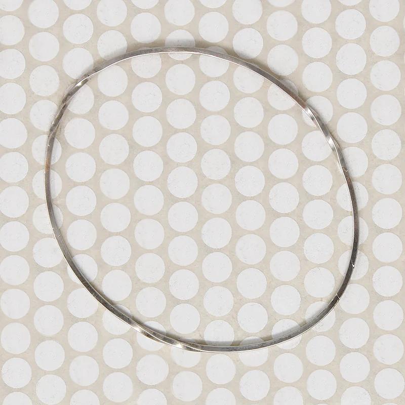 The Endless Twist Oval Bangle in Sterling from Allie B.