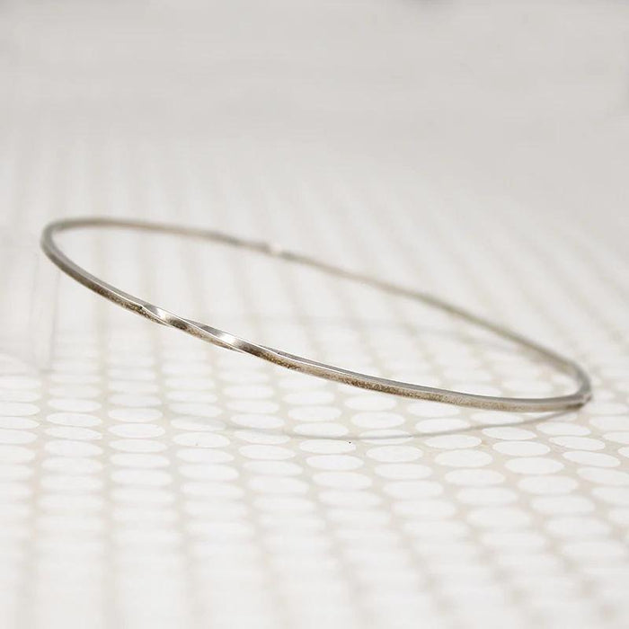 The Endless Twist Oval Bangle in Sterling from Allie B.