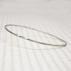 The Endless Twist Oval Bangle in Sterling from Allie B.