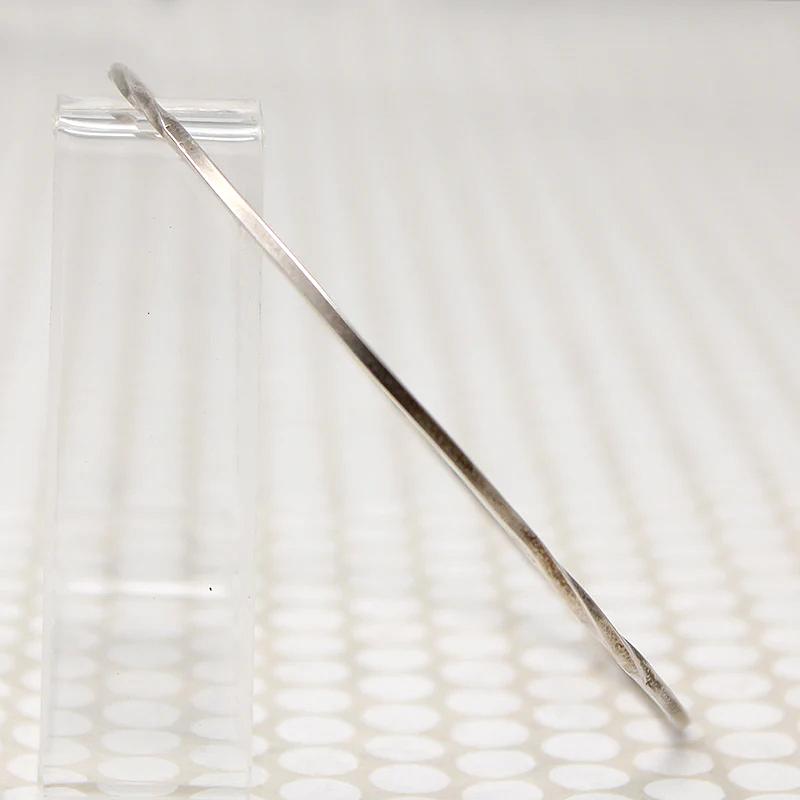 The Endless Twist Oval Bangle in Sterling from Allie B.