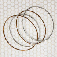 The Endless Twist Oval Bangle in Bronze from Allie B.
