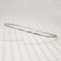 The Endless Twist Round Bangle in Sterling from Allie B.