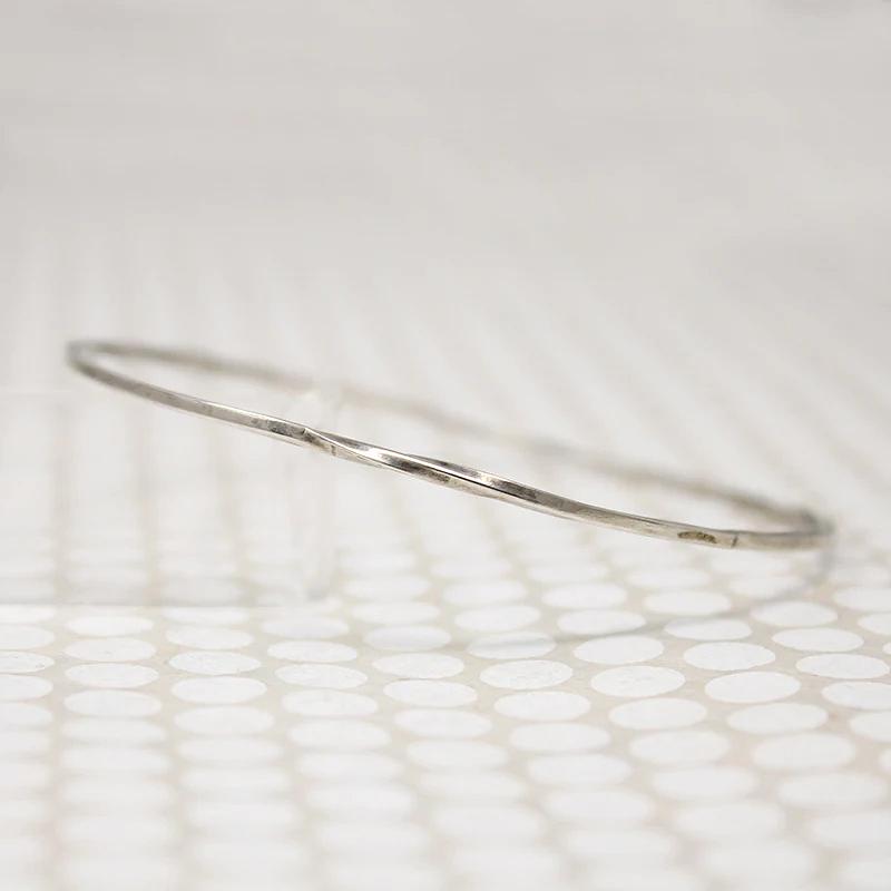 The Endless Twist Round Bangle in Sterling from Allie B.