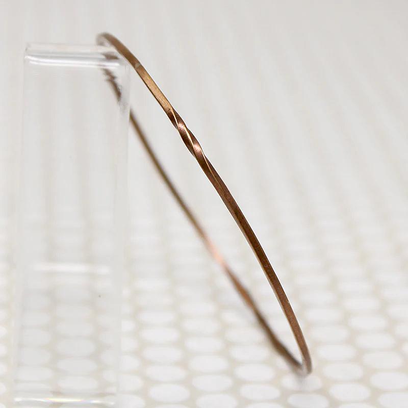 The Endless Twist Round Bangle in Bronze from Allie B.