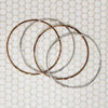 The Endless Twist Round Bangle in Bronze from Allie B.