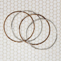 The Endless Twist Round Bangle in Sterling from Allie B.