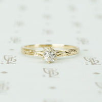 pretty antique engraved rose gold band solitaire with .29ct oec