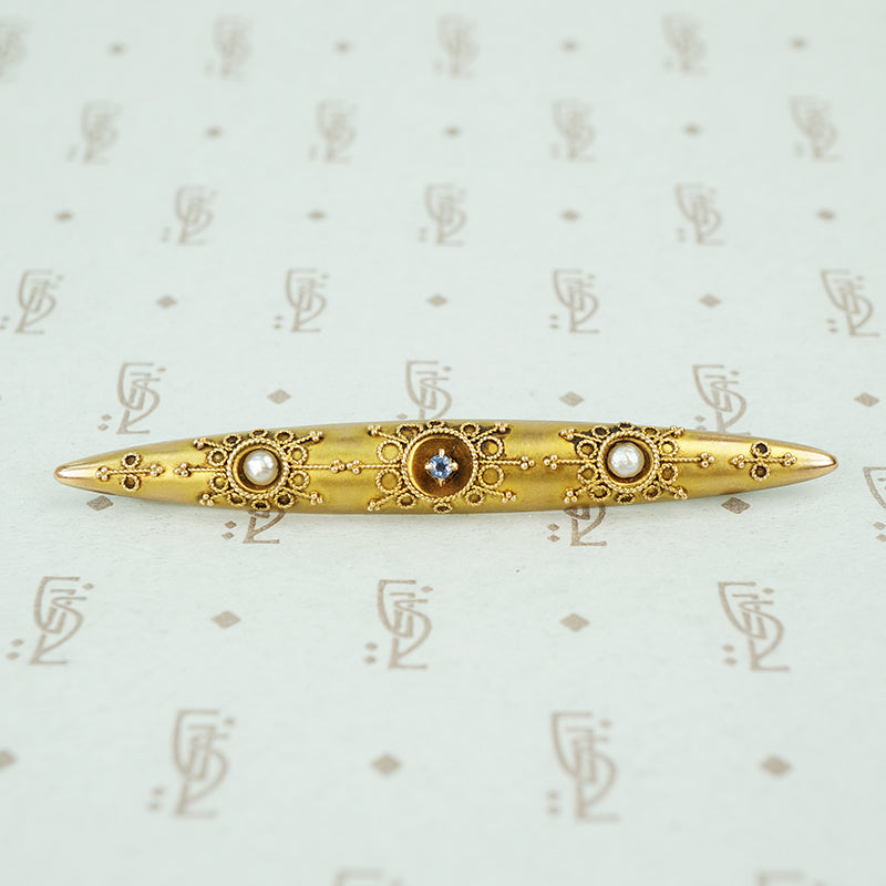 etruscan revival bar pin set with river pearls and montana sapphire