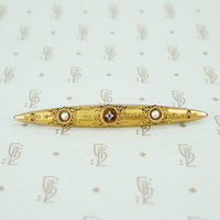 etruscan revival bar pin set with river pearls and montana sapphire