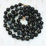 hand faceted banded agate beads on black silk with 14k yellow gold clasp
