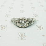 18k white gold art deco filigree engagement ring set with a .45 carat Old Euro diamond VVS