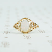 delicate yellow gold filigree opal ring