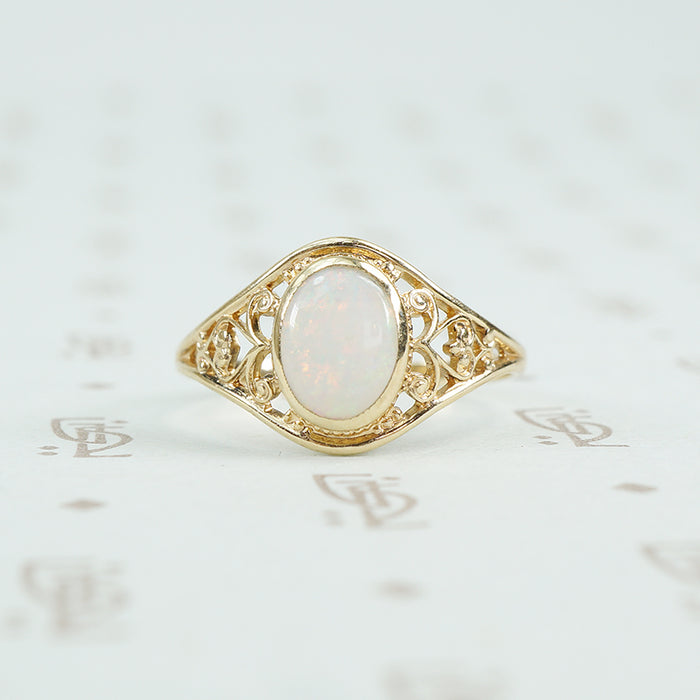 delicate yellow gold filigree opal ring