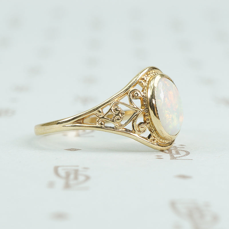 delicate yellow gold filigree opal ring side view