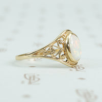 delicate yellow gold filigree opal ring side view