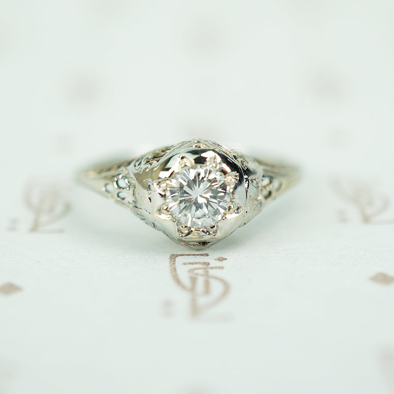 vintage 1920's 18k white gold filigree engagement ring with a .40 carat diamond set in a star 