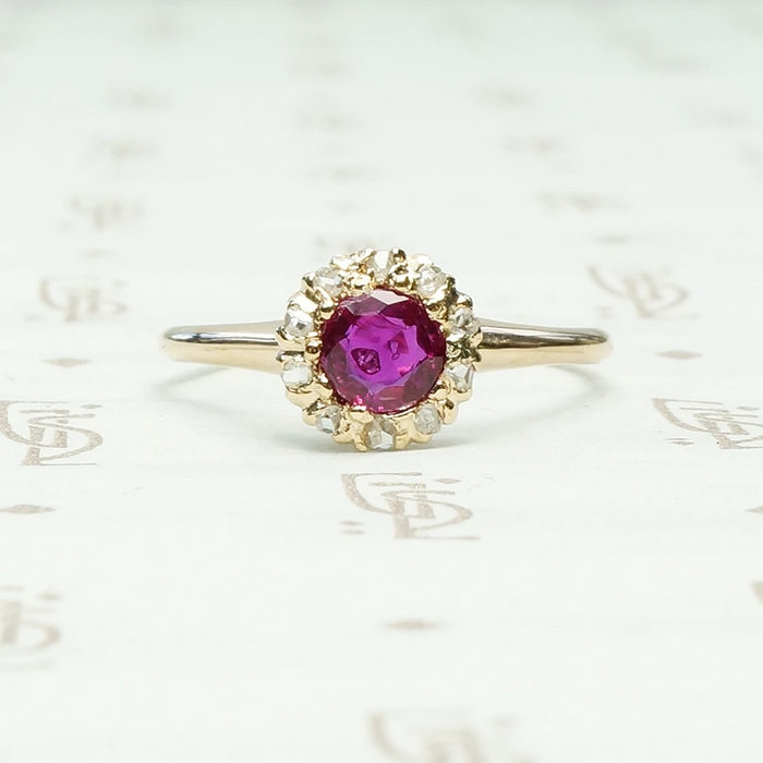 Natural Ruby in 14k yellow gold surrounded by 10 rose cut diamonds ring circa 1880