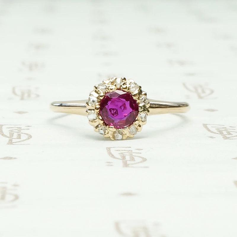 Natural Ruby in 14k yellow gold surrounded by 10 rose cut diamonds ring circa 1880