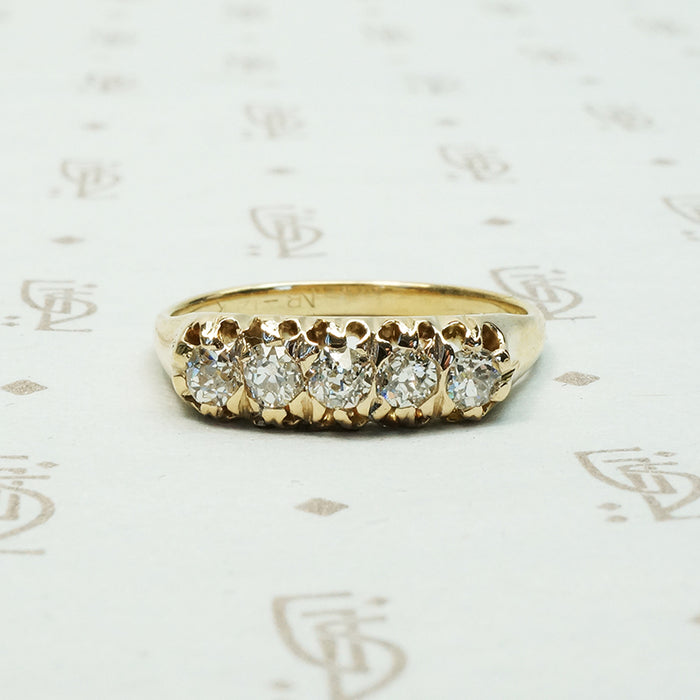 five old mine cut diamond band in melow old yellow gold with flame like ajouring
