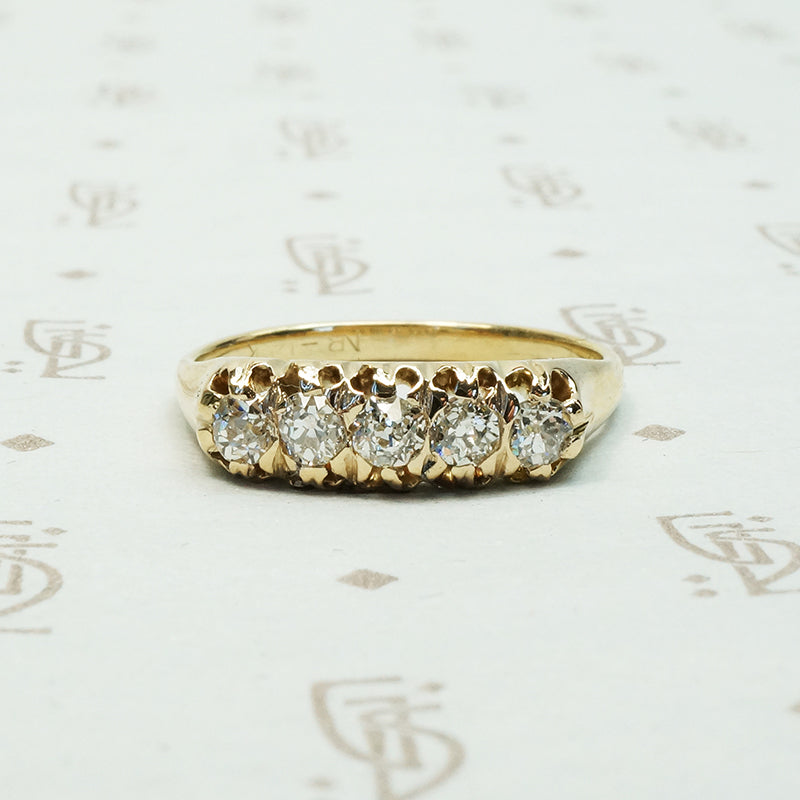 five old mine cut diamond band in melow old yellow gold with flame like ajouring