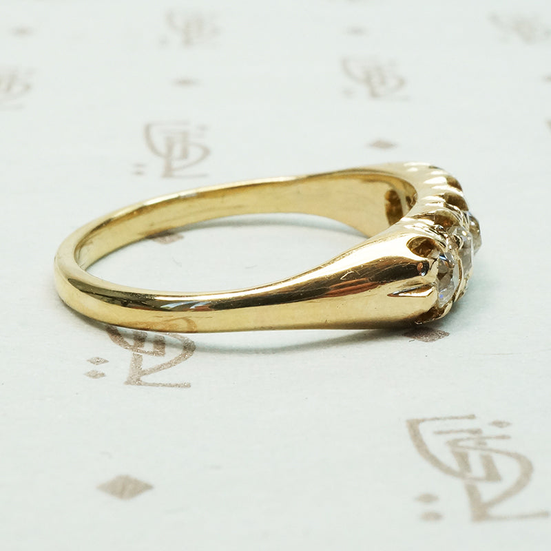 five old mine cut diamond band in melow old yellow gold with flame like ajouring