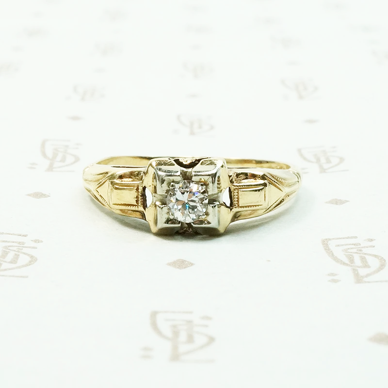 pretty 2 tone gold and diamond set engagement ring