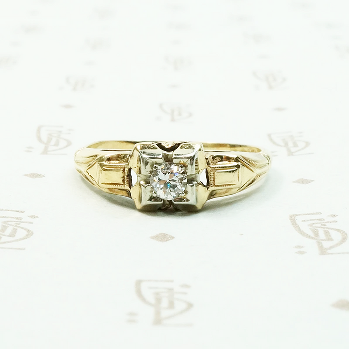 pretty 2 tone gold and diamond set engagement ring