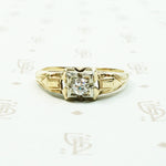 pretty 2 tone gold and diamond set engagement ring