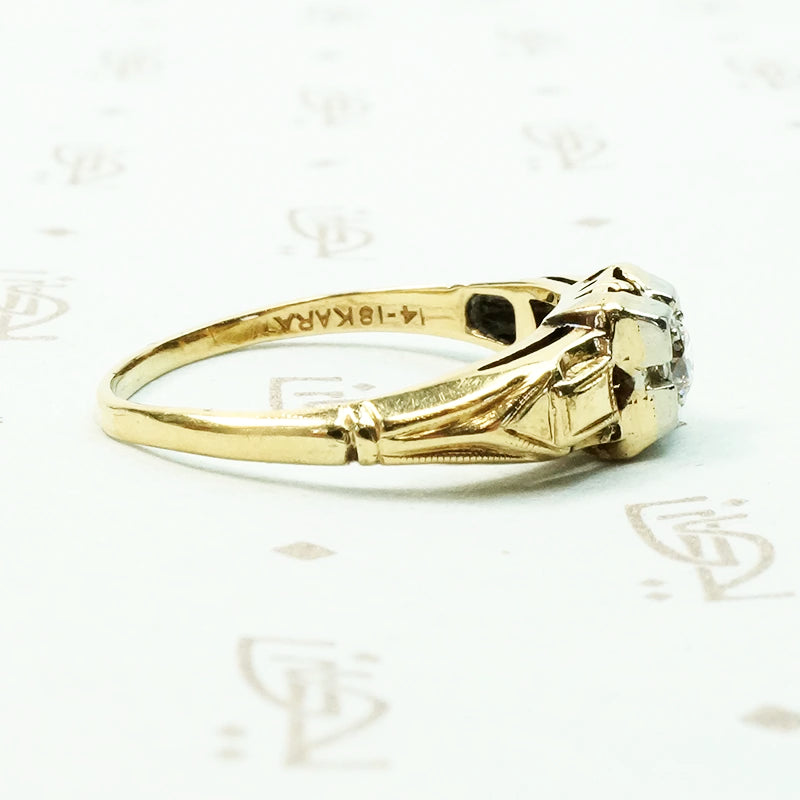 pretty 2 tone gold and diamond set engagement ring