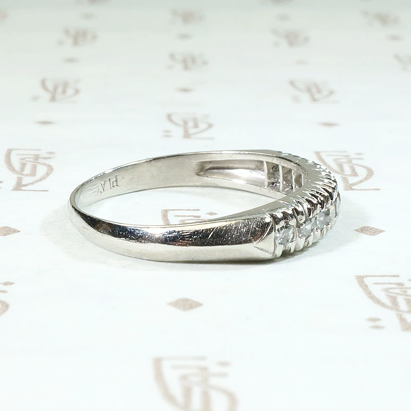 Interesting Ten Diamond & Platinum Wedding Band