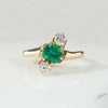 Jaunty Emerald Ring with Dazzling Accent Diamonds