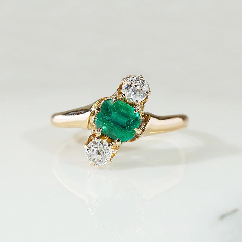 Jaunty Emerald Ring with Dazzling Accent Diamonds