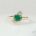 Jaunty Emerald Ring with Dazzling Accent Diamonds