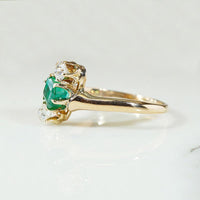 Jaunty Emerald Ring with Dazzling Accent Diamonds