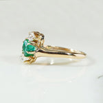 Jaunty Emerald Ring with Dazzling Accent Diamonds
