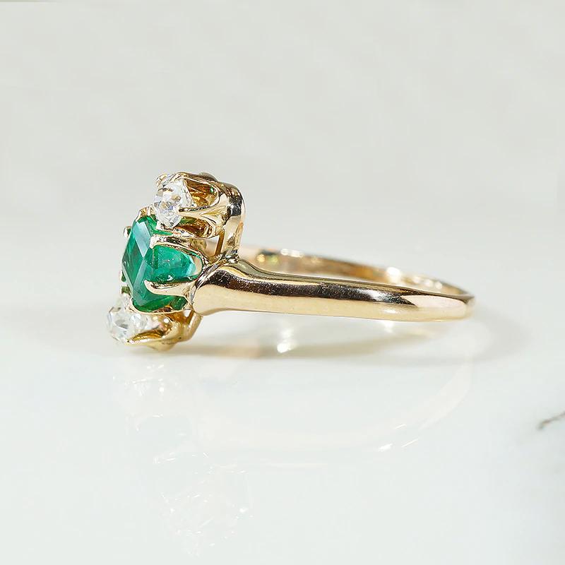 Jaunty Emerald Ring with Dazzling Accent Diamonds