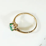 Jaunty Emerald Ring with Dazzling Accent Diamonds
