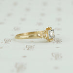 side view showing the details of the yellow gold flower ring