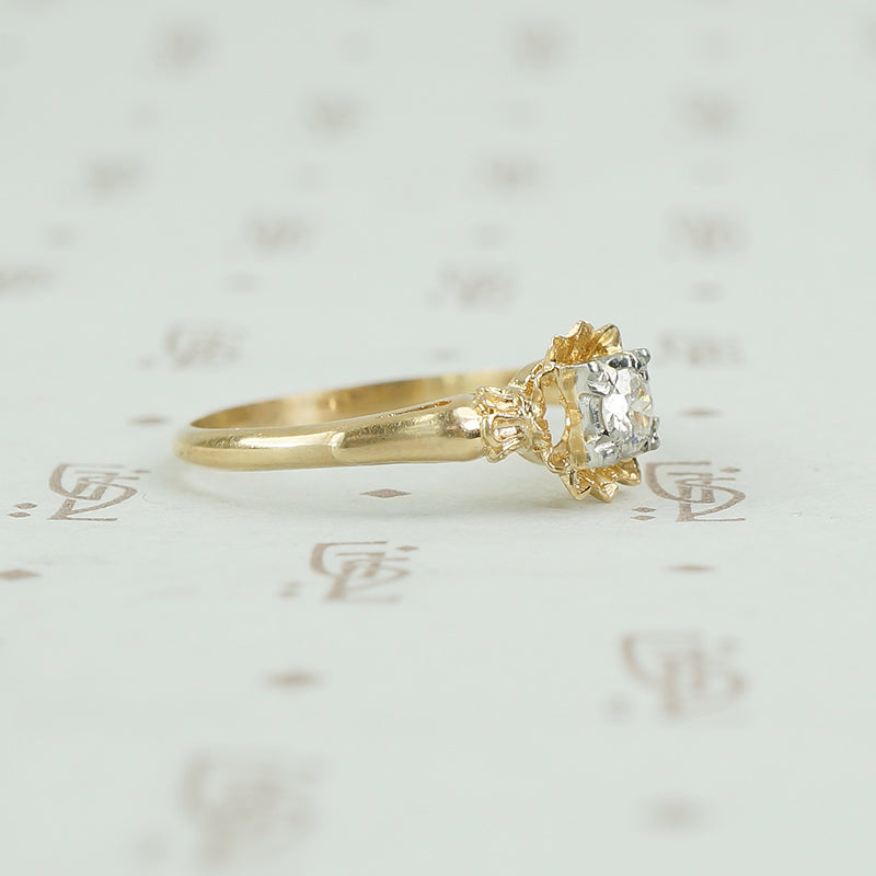 side view showing the details of the yellow gold flower ring
