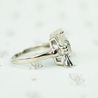 side view of 14k white gold flower diamond ring circa 1940