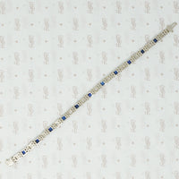 1920's white gold syn sapphire french cut and diamond line bracelet