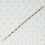 1920's white gold syn sapphire french cut and diamond line bracelet